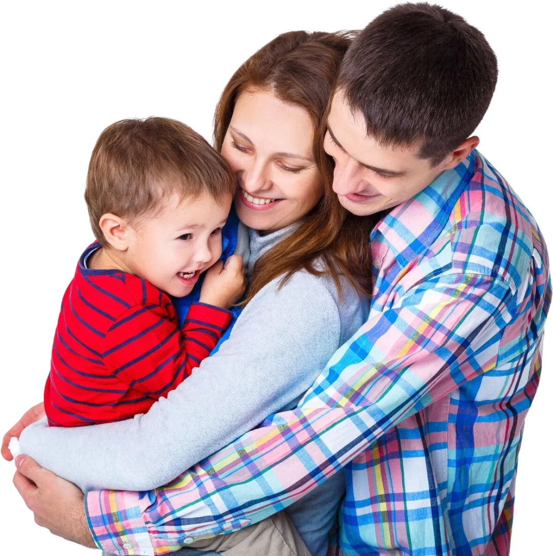 A mother and father hugging their laughing son